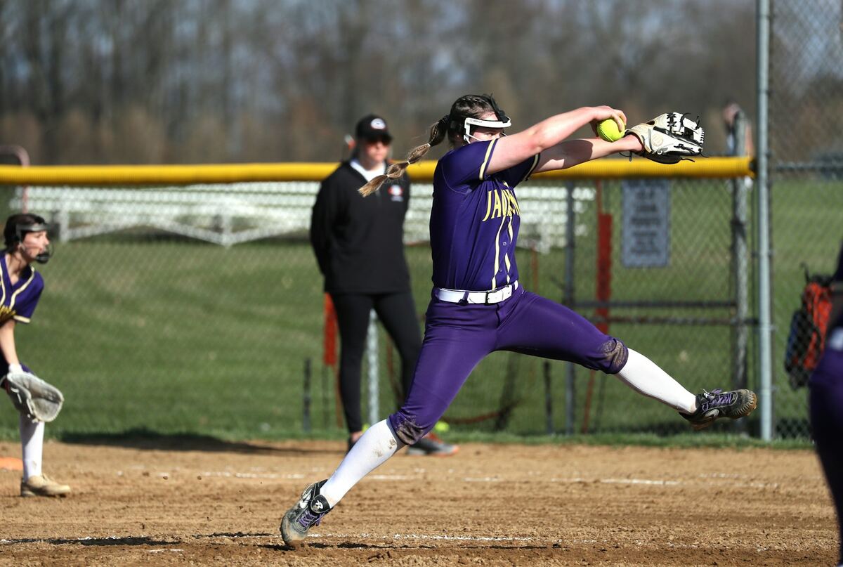 Softball pitcher releasing a pitch during a game